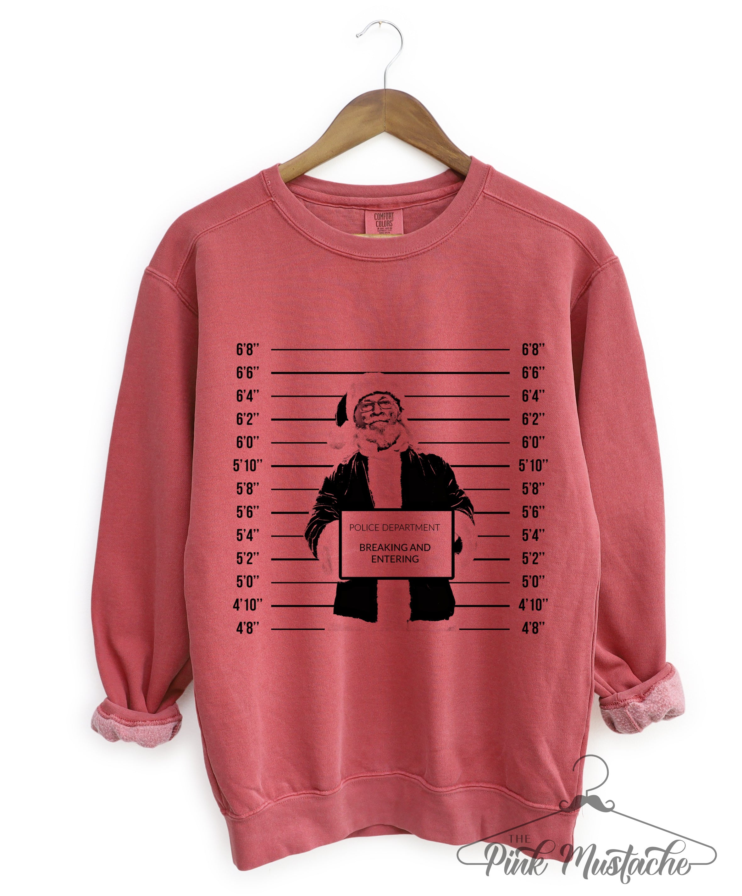 The Pink Mustache Crimson Comfort Colors Naughty Santa Mugshot Christmas Sweatshirt Adult Sizes Adult XL